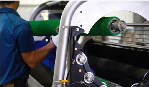 An industrial peeler roller is changed out during maintenance. An industrial peeler roller is changed out during maintenance.